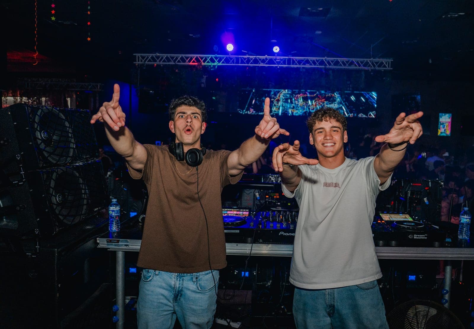 Backstage, pointing at the camera after a set